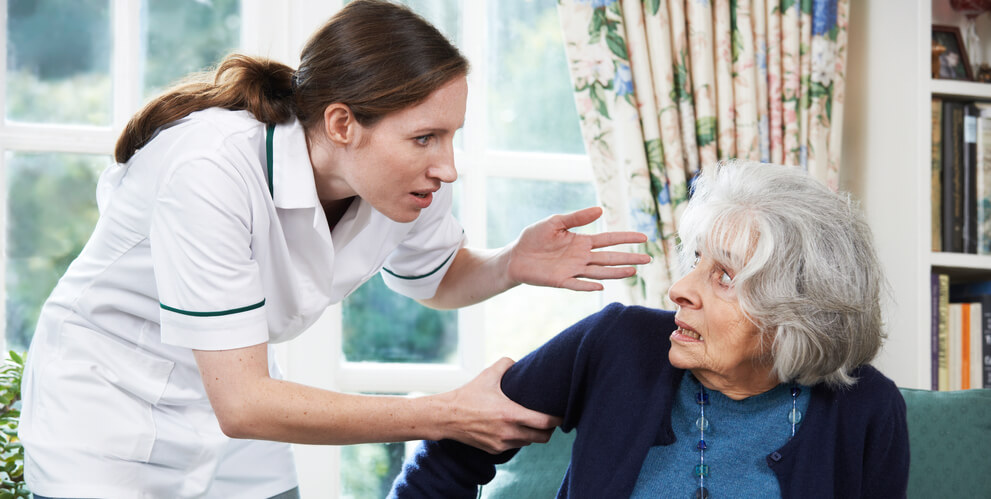 nursing home employee aggressively grabbing the arm of an elderly resident illustrating a case handled by Wilk Law Personal Injury & Car Accident Lawyers