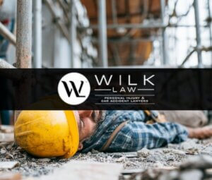 Construction worker lying on the ground injured after falling from scaffolding in Philadelphia, Pennsylvania related to a case handled by Wilk Law Personal Injury & Car Accident Lawyers