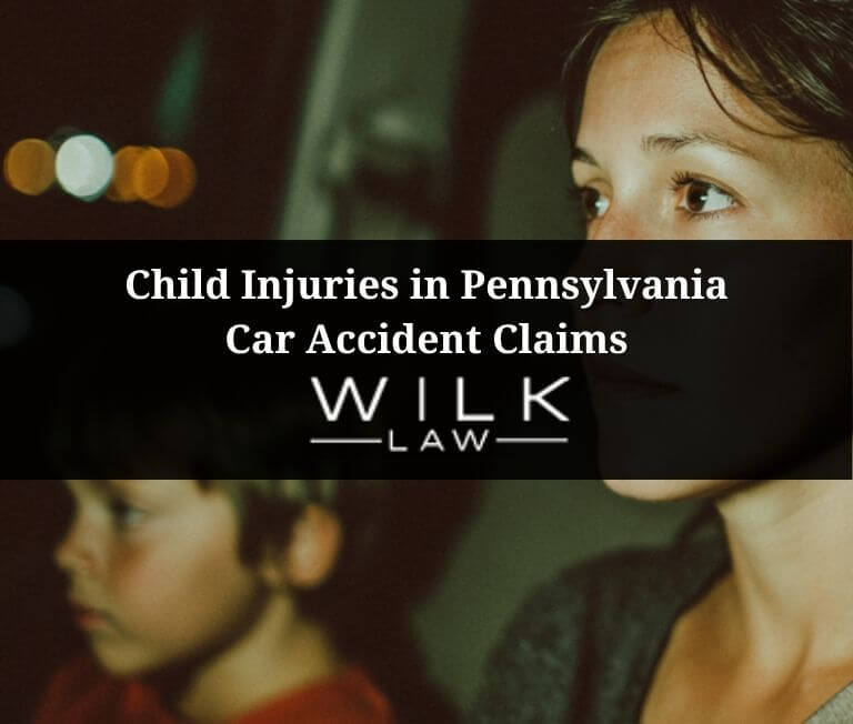 Mother and child in her car driving in Philadelphia, Pennsylvania