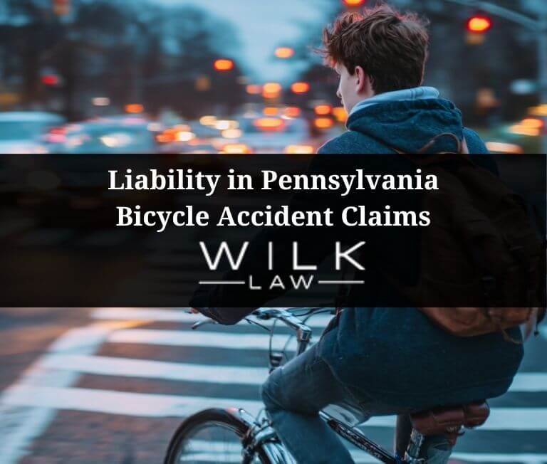 Teenager on bicycle crossing the road in Philadelphia, Pennsylvania
