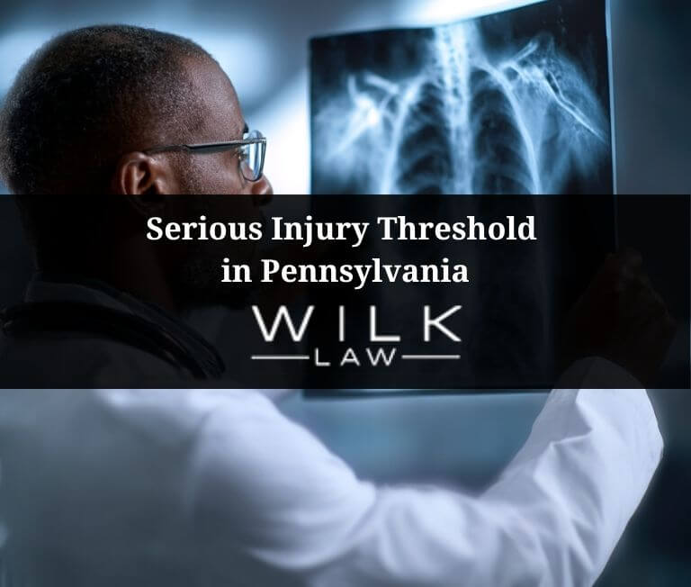 Doctor looking over an x-ray of an injured motorist in Philadelphia, Pennsylvania