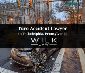 Crashed Turo rental car in an intersection in Philadelphia, Pennsylvania related to a case handled by Wilk Law Personal Injury & Car Accident Lawyers