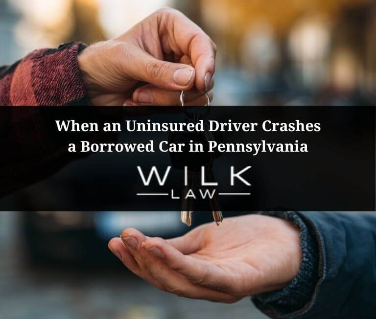 Driver handing over car keys to an uninsured driver in Pennsylvania