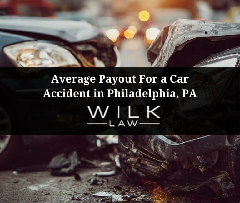 Two crashed cars at an intersection in Philadelphia, Pennsylvania illustrating the average payout for a car accident claim in Philadelphia