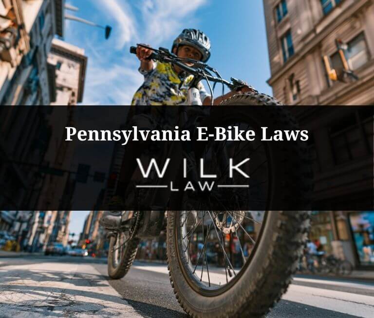 Cyclist on an e-bike in downtown Philadelphia illustrating Pennsylvania e-bike laws
