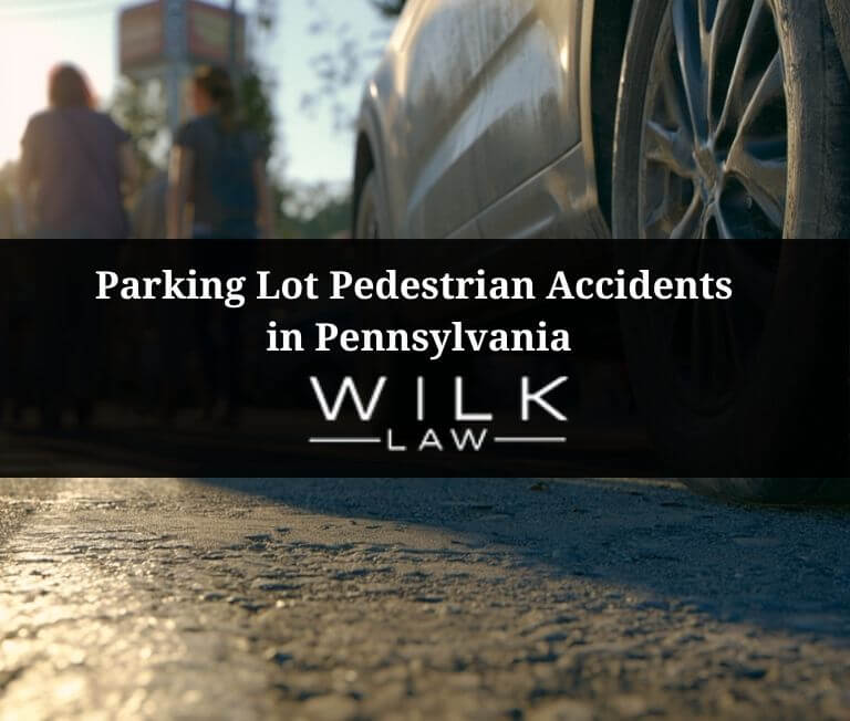 Pedestrians walking behind a parked SUV in a grocery store parking lot in Philadelphia, Pennsylvania