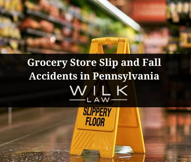 Yellow slippery floor sign on the ground in an aisle in a grocery store in Pennsylvania