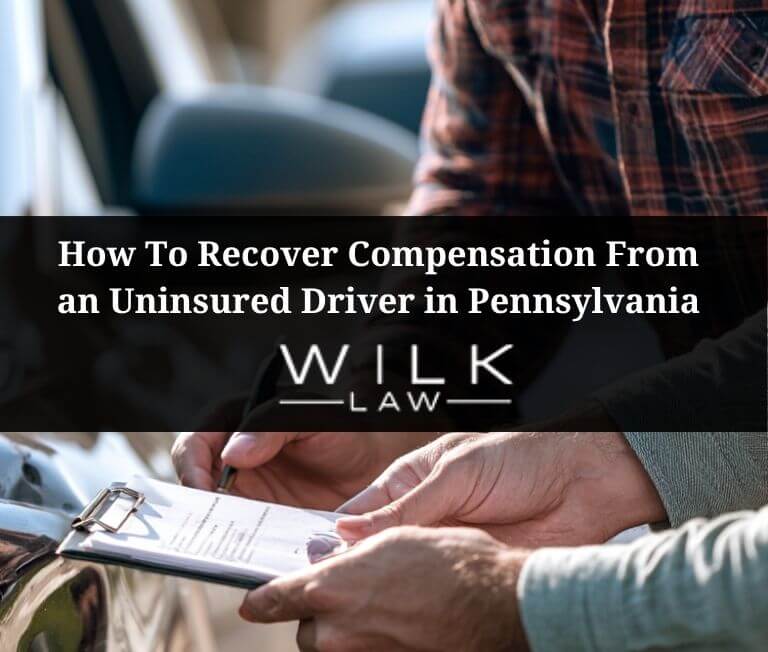 Two drivers exchanging information after a car accident in Philadelphia, PA