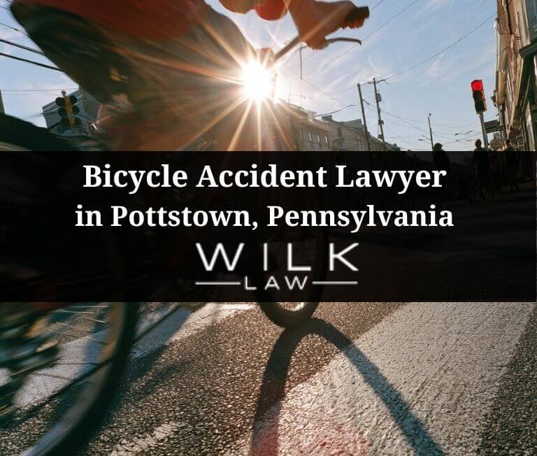 Teenager on a bicycle crossing the street in Pottstown, Pennsylvania related to a case handled by Wilk Law Personal Injury & Car Accident Lawyers
