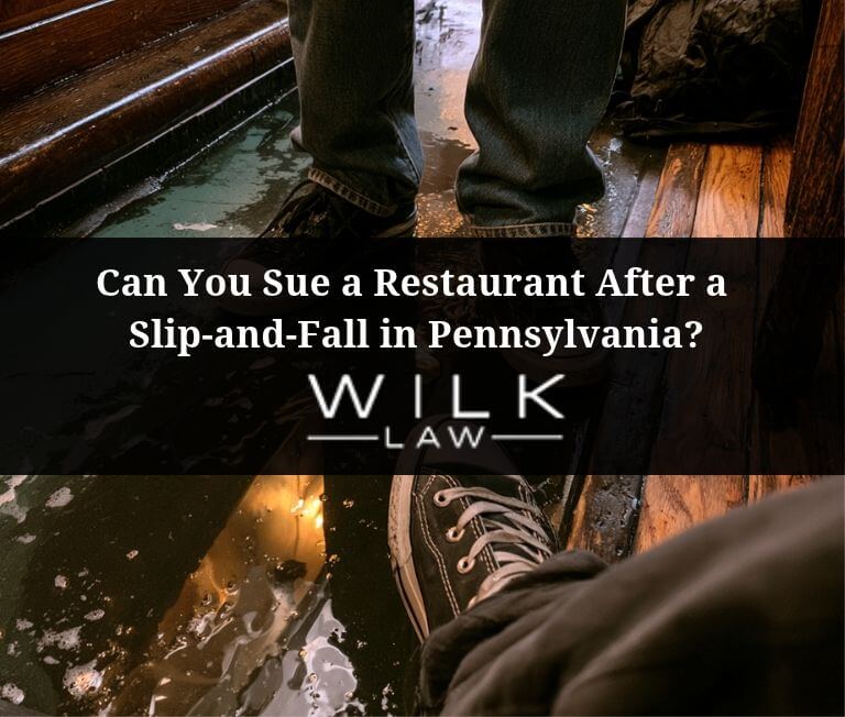 Patrons walking on a wet floor in a restaurant in Philadelphia, Pennsylvania