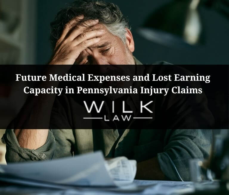 Tired looking man overwhelmed by future medical expenses and lost earning capacity in Pennsylvania injury claims