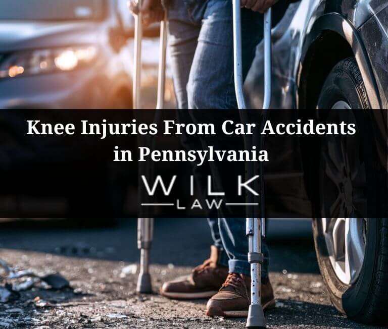 Man on crutches after injuring his knees in a car accident in Pennsylvania